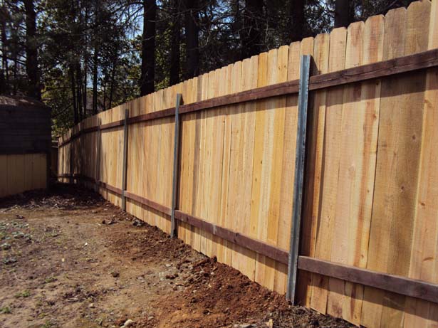 back side of cedar fence on master posts