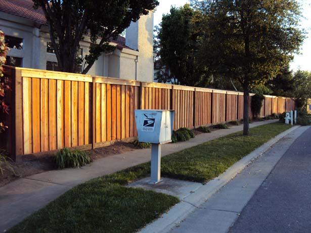 custom fence with overlapped fence boards 