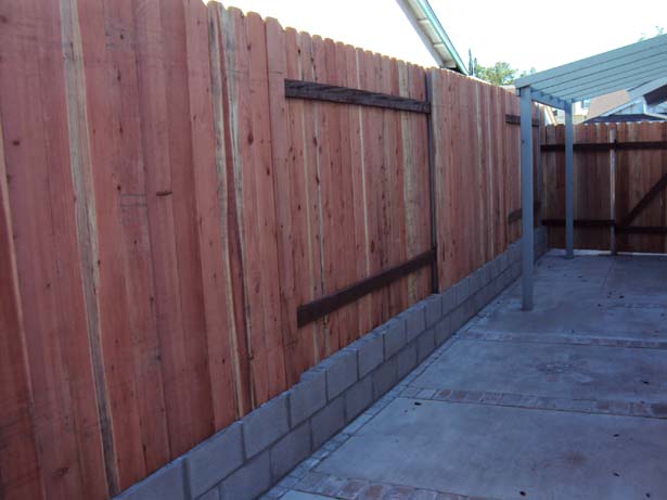 fence with block retaining wall