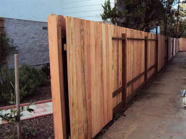 completed fence with 6 inch pressure-treated kickboard